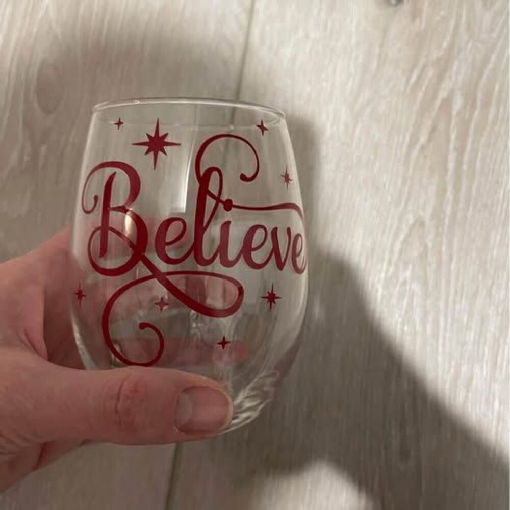 stemless wine glass says Believe